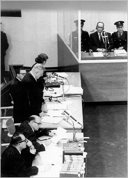 View of the courtroom with Eichmann behind protective glass